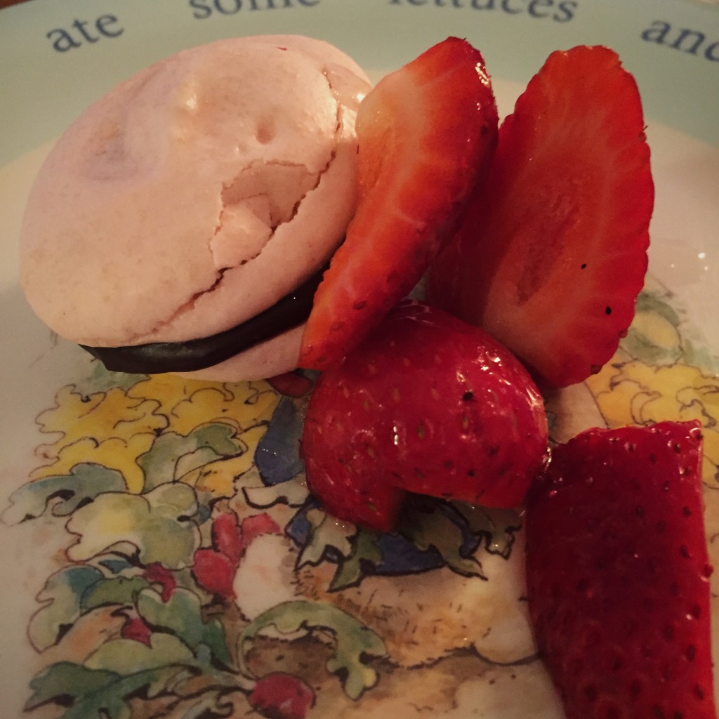 Strawberry macaroon with chocolate ganache filling